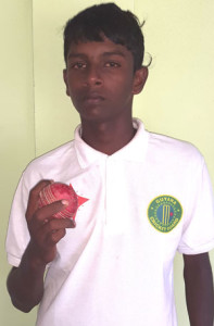 Demerara’s tormentor with the ball, Sagar Hetheramani displays the red cherry he used to torment their batsmen on his way to snaring 6 for 59