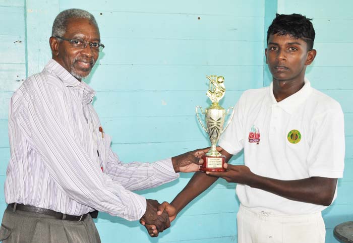 Sagar Hatheramani accepts his man-of-the-match prize from match referee Grantley Culbard