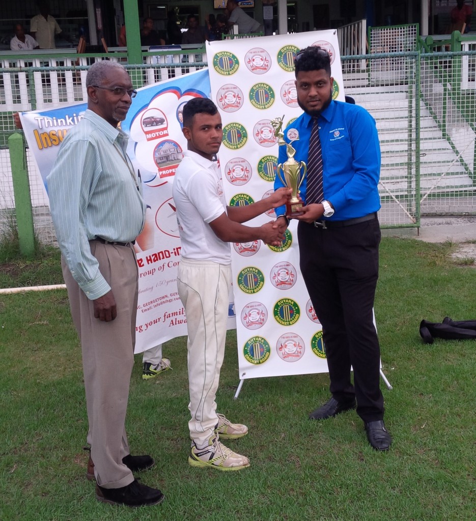 Renaldo Renee receiving his man-of-the-match trophy from HIH representative in the presence of the match referee
