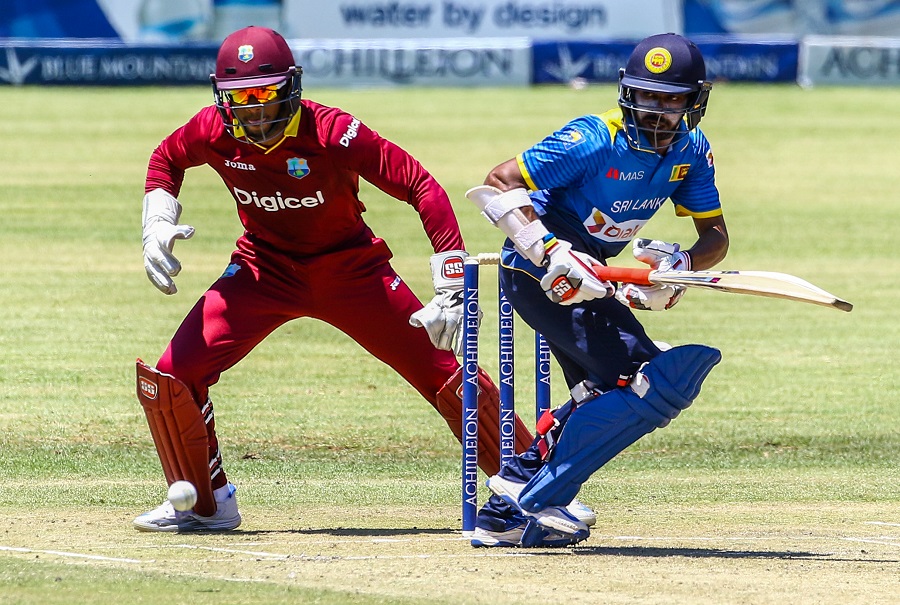 Sri Lanka batsman Niroshan Dickwella is in action during the fifth match of triangular one-day international series between Sri Lanka and West Indies at the Queens Sports Club in Bulawayo, on November 23 2016. / AFP PHOTO / Jekesai Njikizana